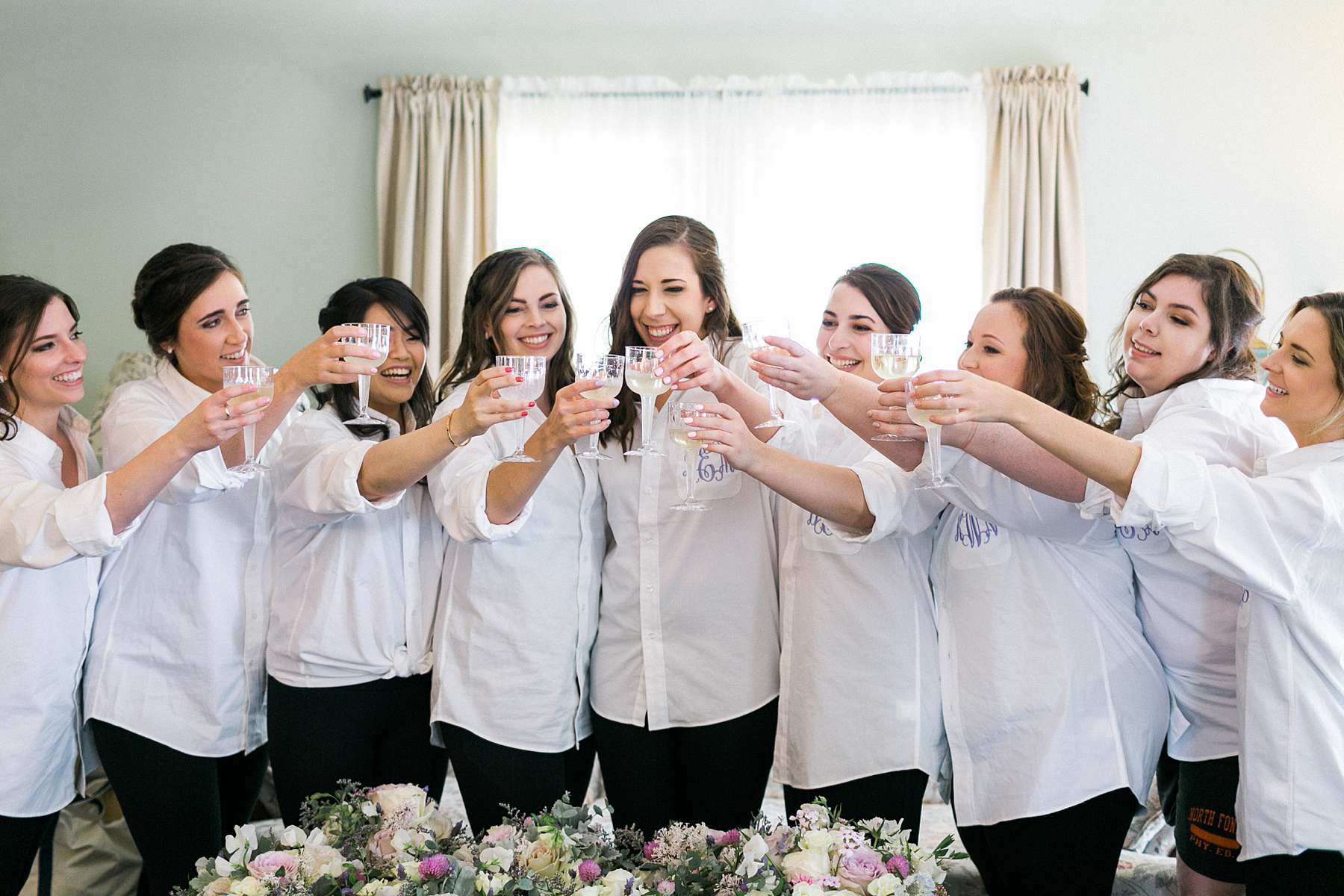 bride and bridesmaids with champagne, rustic romantic wedding at over the vines with midwestern bride, photo by laurelyn savannah photography