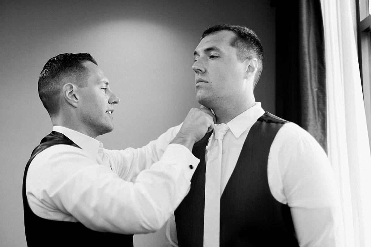 groom getting ready, romantic lavender wisconsin wedding at mercantile hall, photo by laurelyn savannah photography