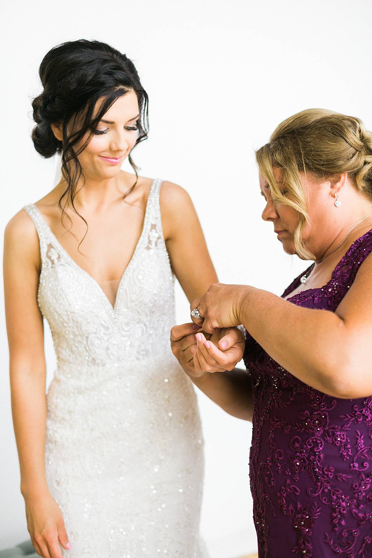 bride getting ready, romantic lavender wisconsin wedding at mercantile hall, photo by laurelyn savannah photography