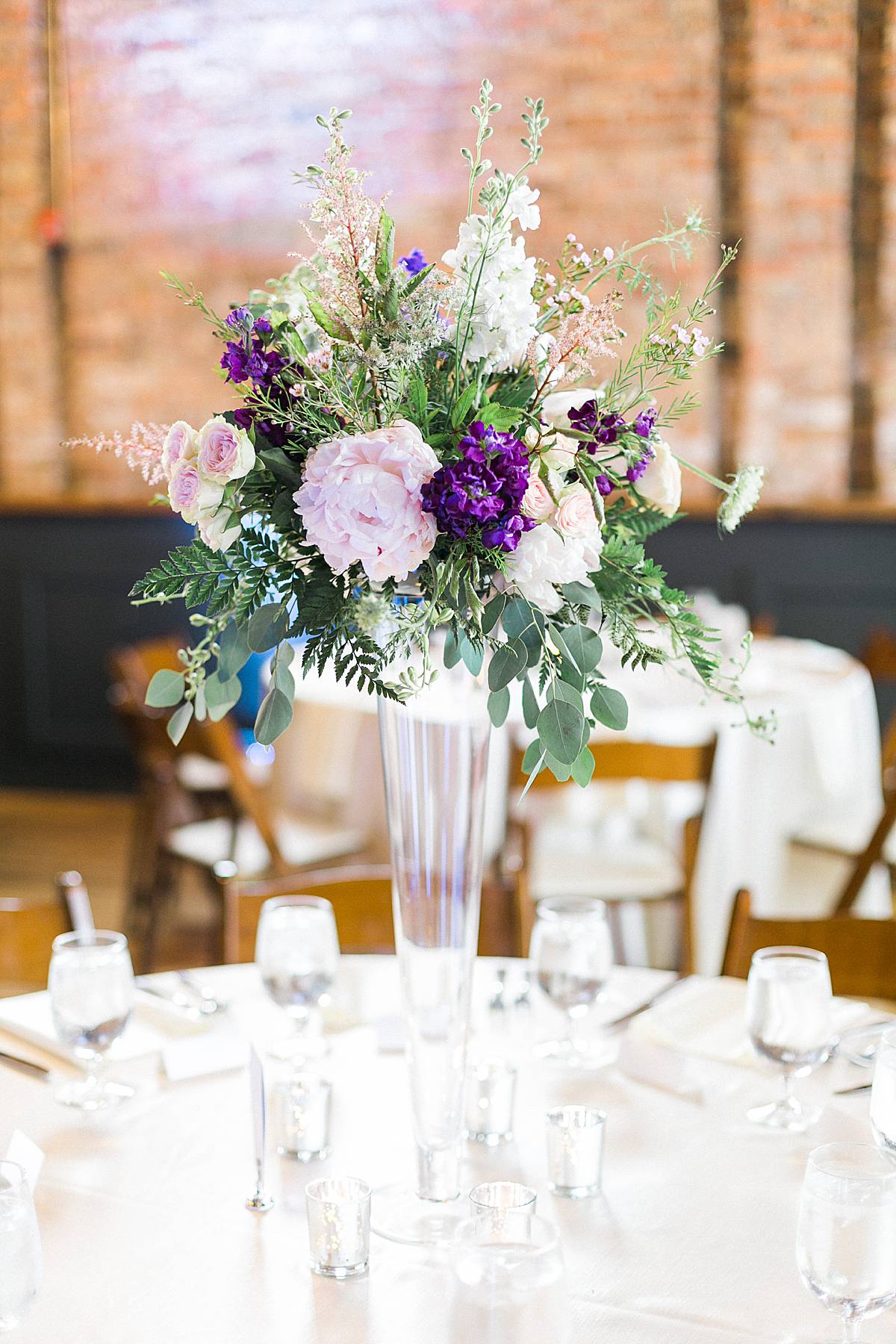 reception decor, romantic lavender wisconsin wedding at mercantile hall, photo by laurelyn savannah photography