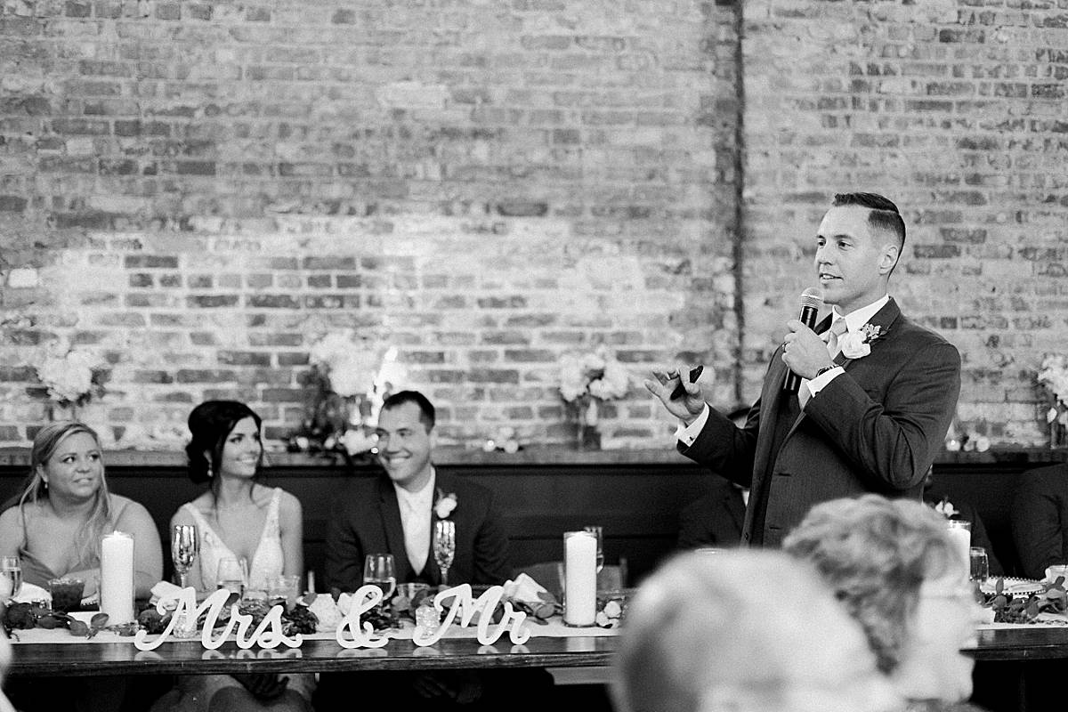 reception toast speech, romantic lavender wisconsin wedding at mercantile hall, photo by laurelyn savannah photography
