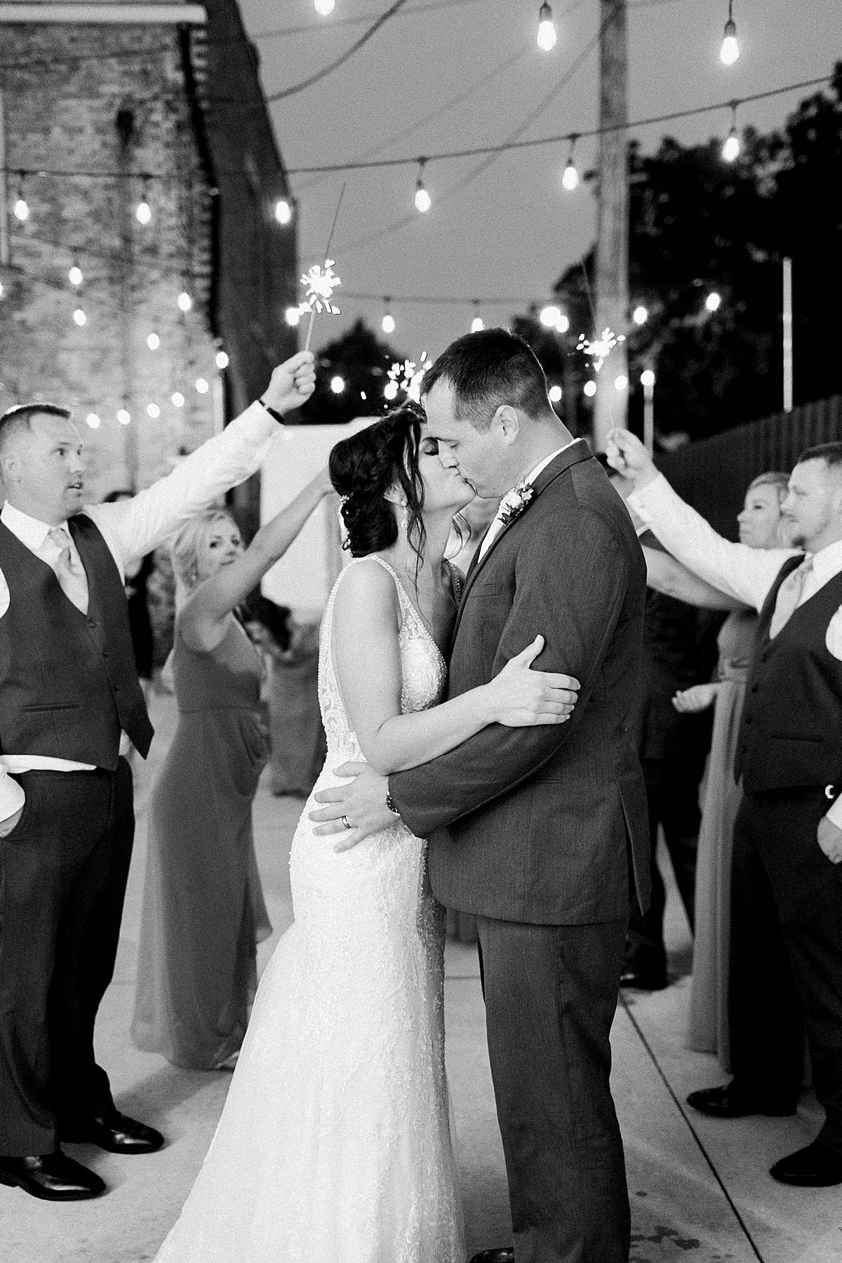 bride and groom sparkler exit, romantic lavender wisconsin wedding at mercantile hall, photo by laurelyn savannah photography