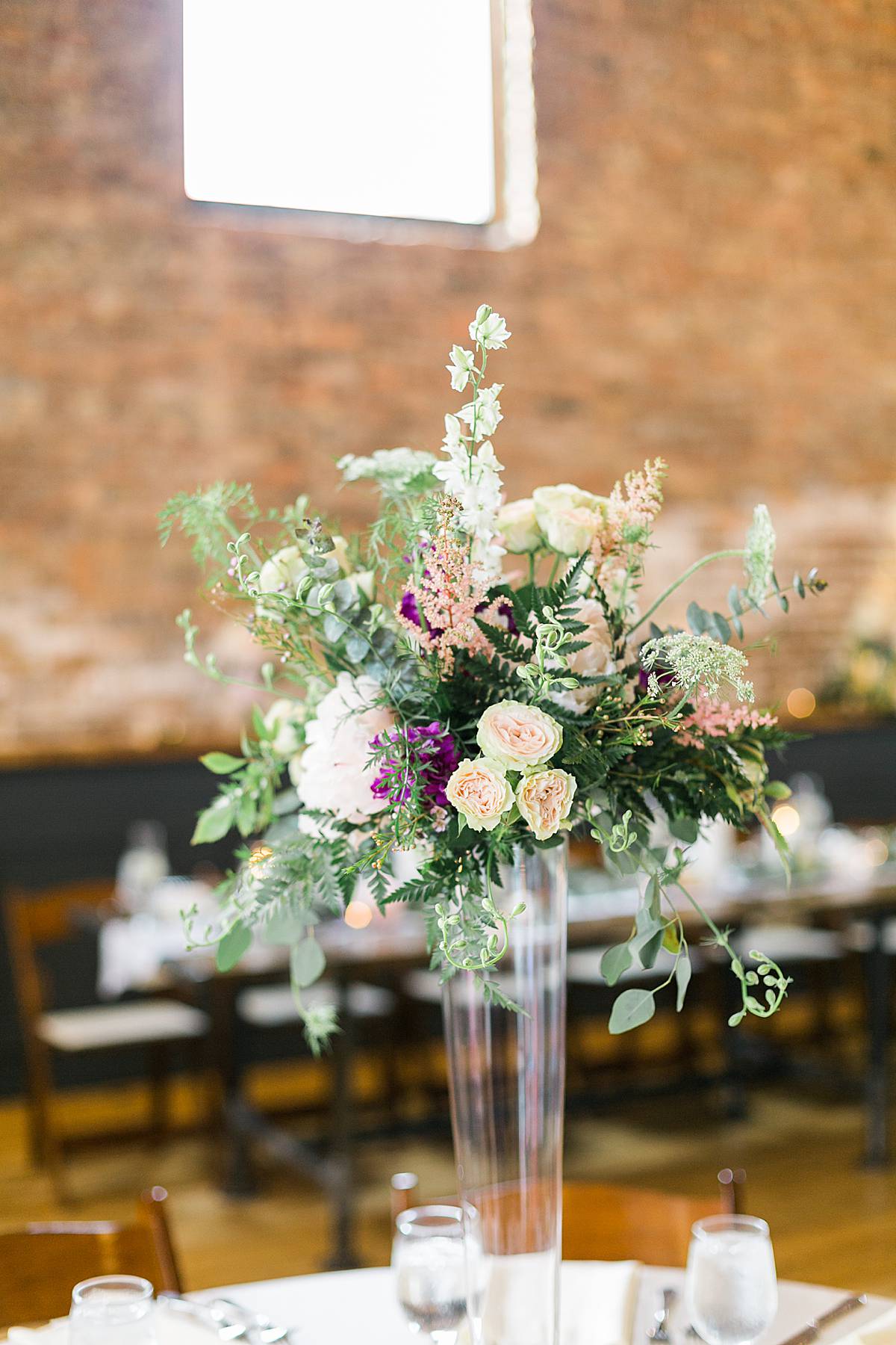 reception decor, romantic lavender wisconsin wedding at mercantile hall, photo by laurelyn savannah photography