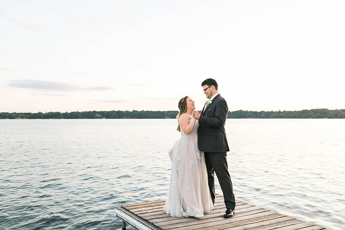sunset bride and groom portraits, classic lakeside wisconsin wedding at oconomowoc lake club, photo by laurelyn savannah photography
