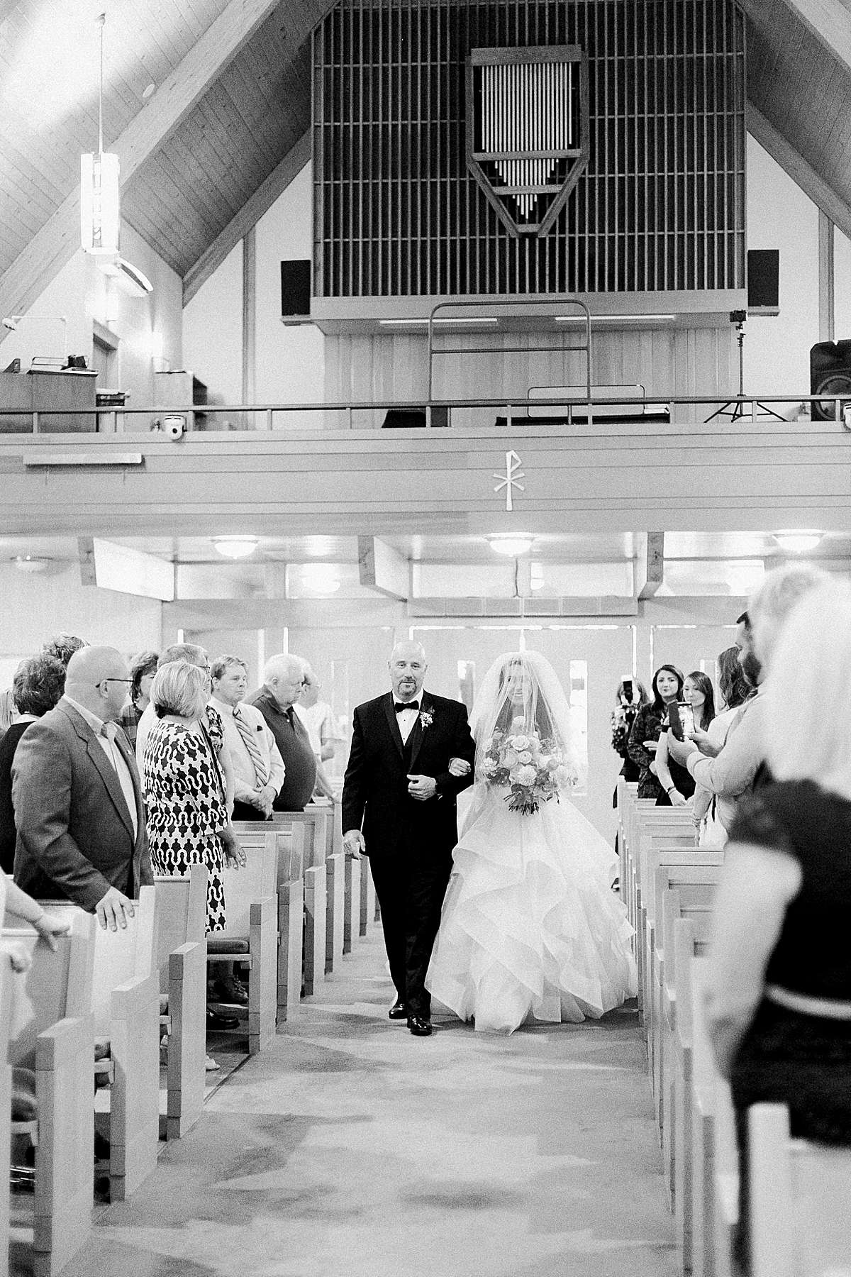 bride entering ceremony, romantic wisconsin wedding at sentry world stevens point, photo by laurelyn savannah photography