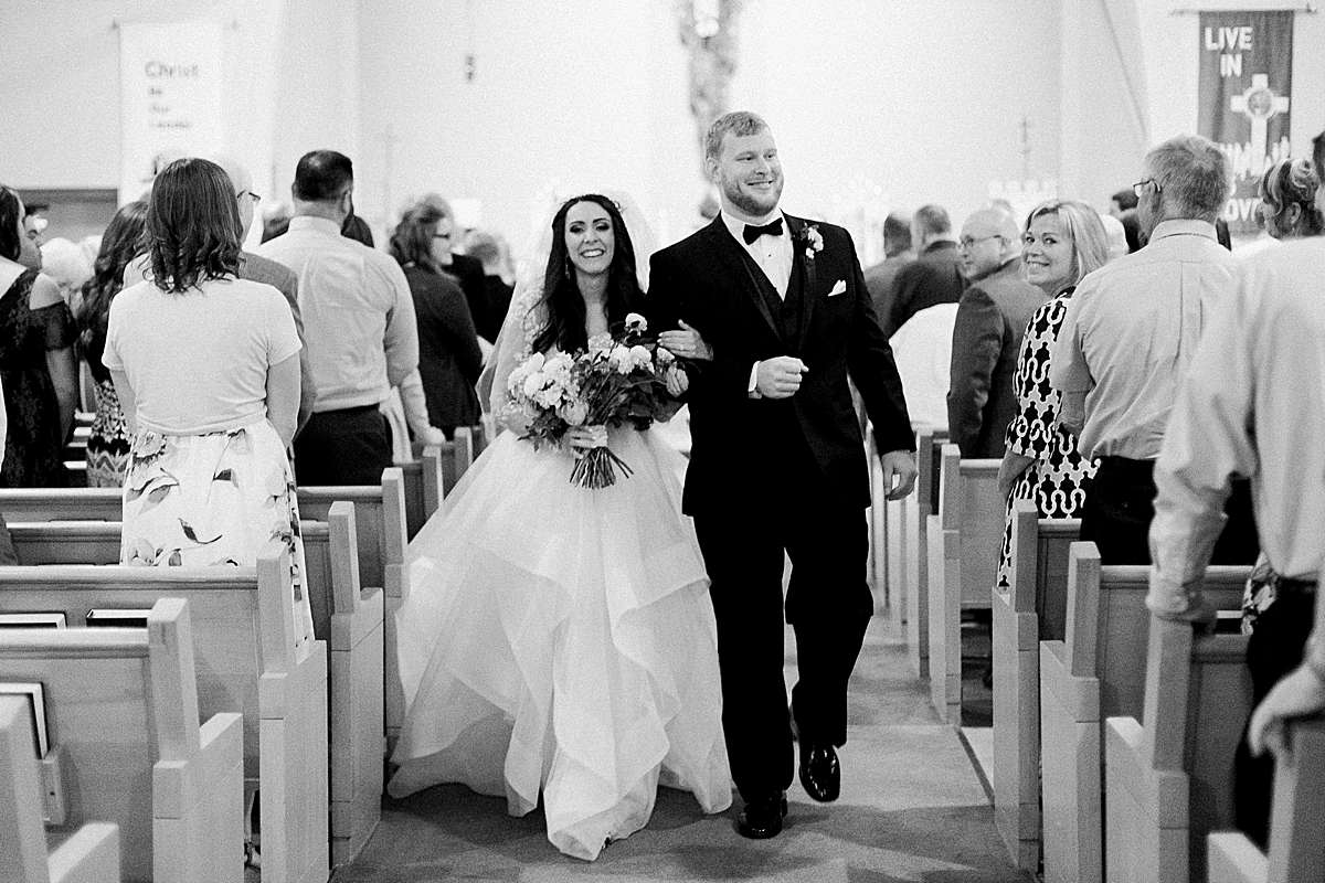 ceremony exit, romantic wisconsin wedding at sentry world stevens point, photo by laurelyn savannah photography