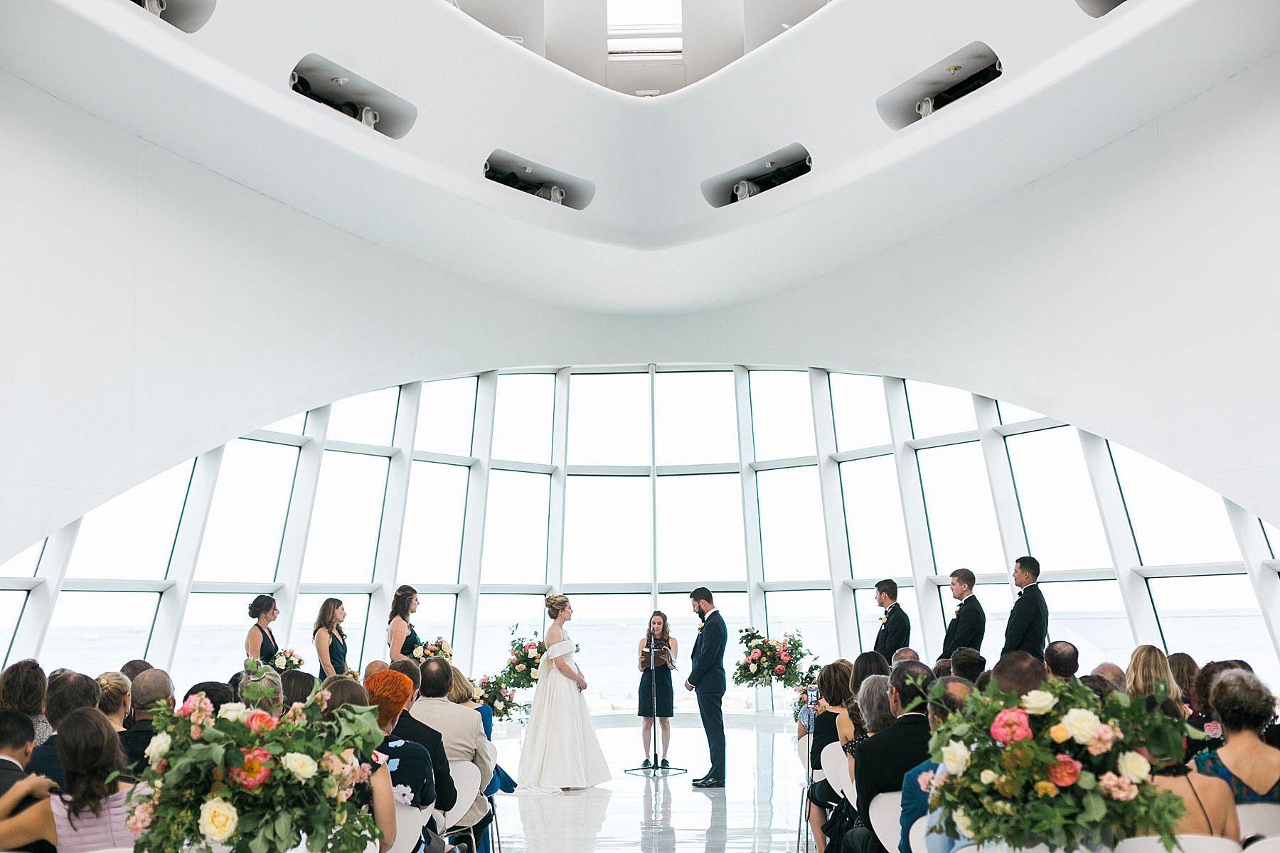 modern minimal white and bright wedding ceremony at milwaukee art museum an architectural gem downtown with lake michigan view