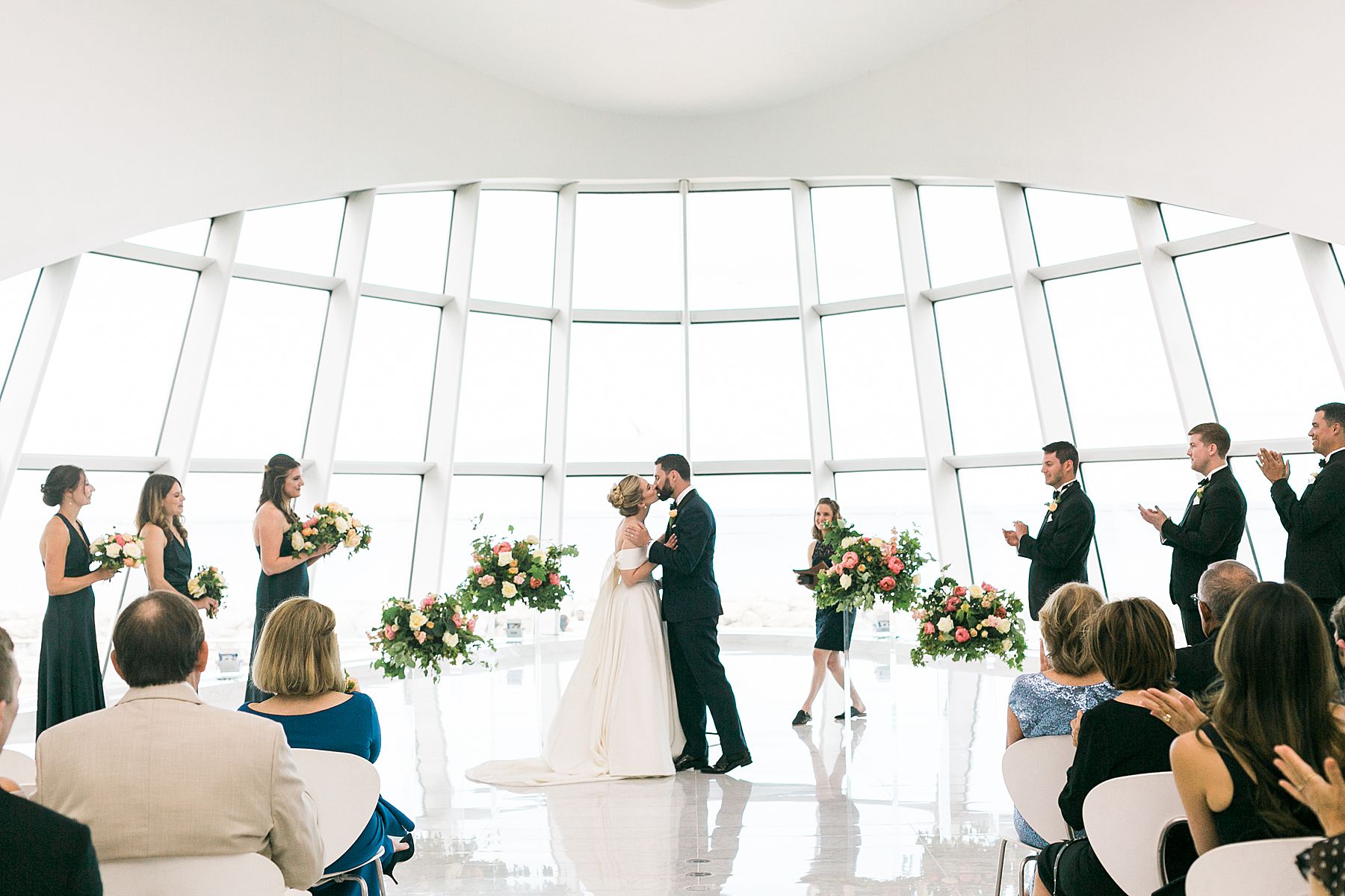 first kiss, modern minimal white and bright wedding ceremony at milwaukee art museum an architectural gem downtown with lake michigan view