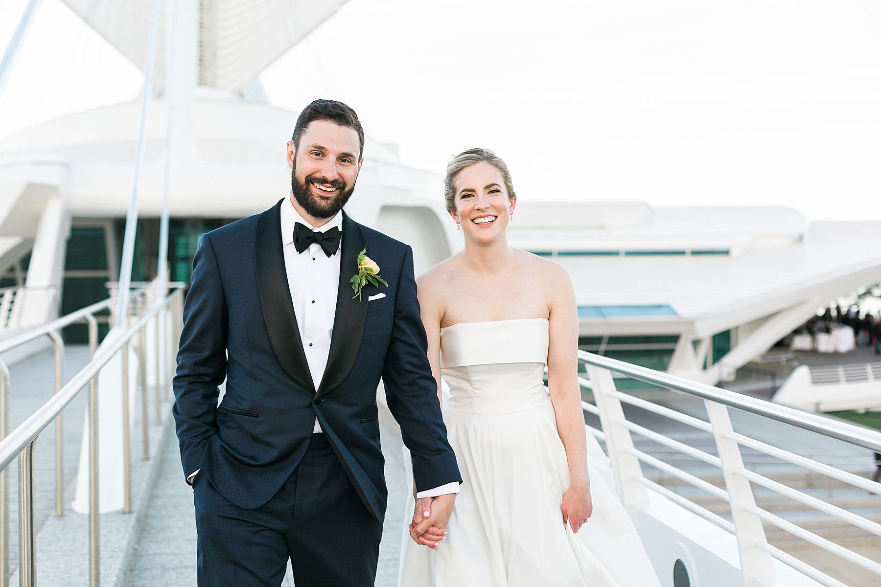 wedding couples newlywed portraits photos at modern minimal milwaukee art museum architectural gem on lake michigan in downtown