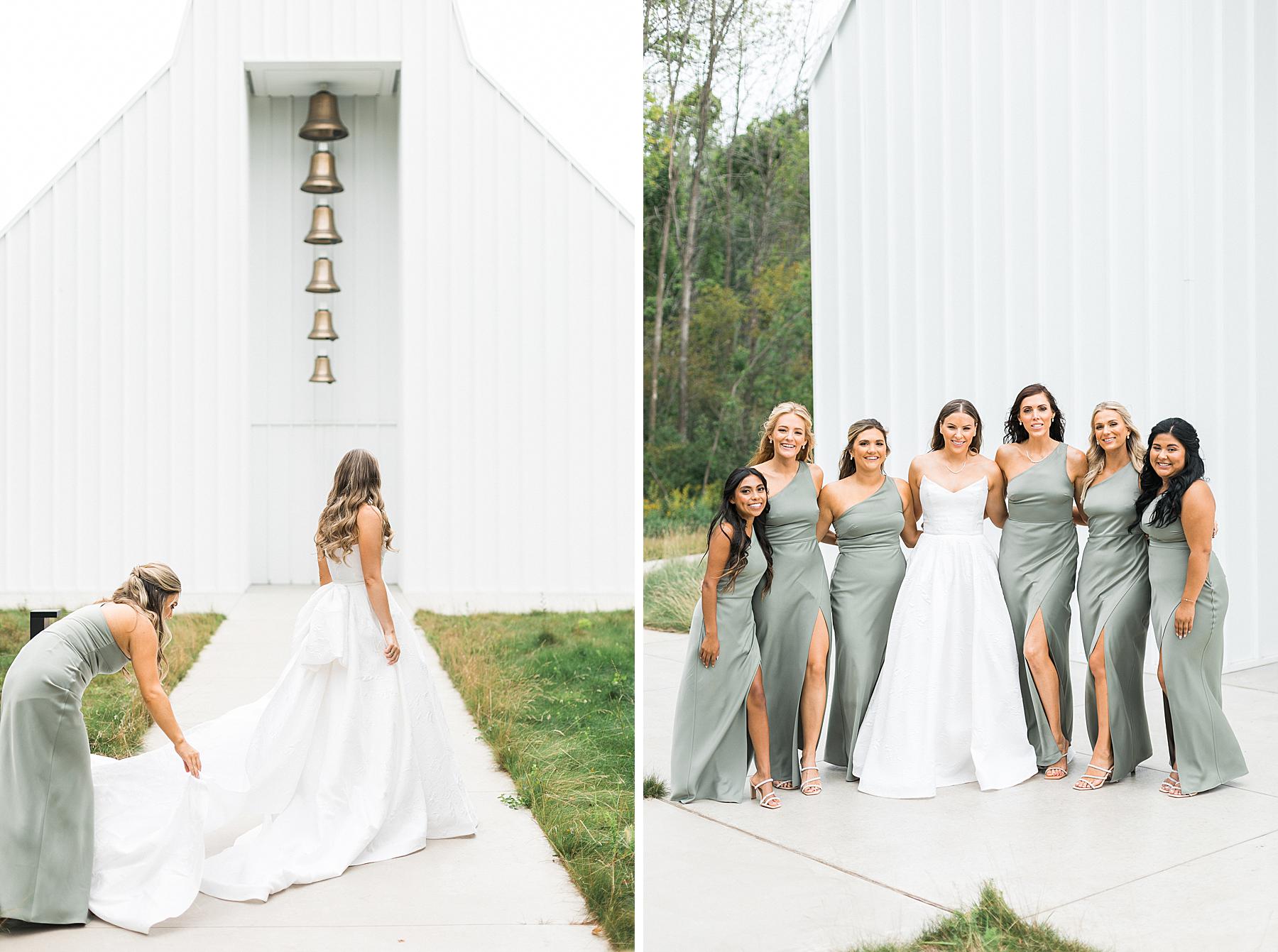 bride and bridesmaids in front of traditional white chapel for wedding ceremony at straits chapel in kohler wisconsin
