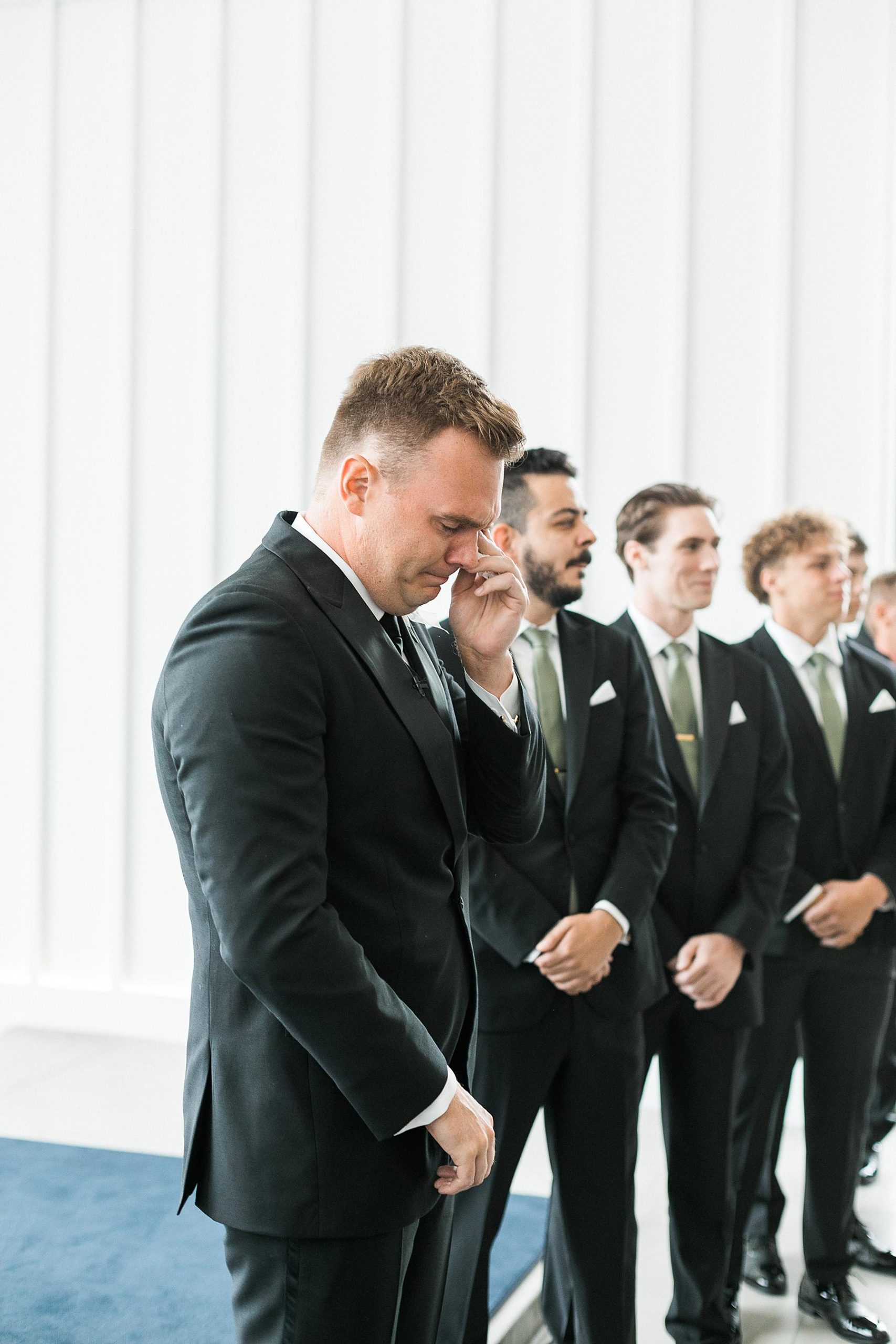 groom reaction to bride entering the wedding ceremony at straits chapel in kohler wisconsin