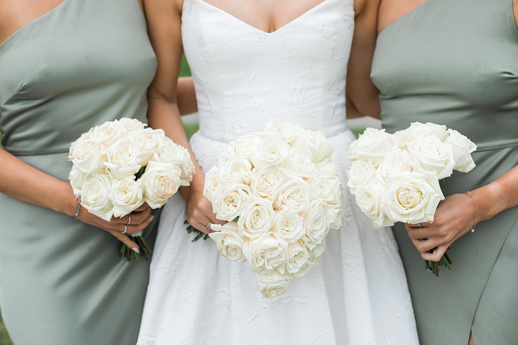 bride and bridesmaid white classic flower bouquets at irish barn at whistling straits in kohler wisconsin