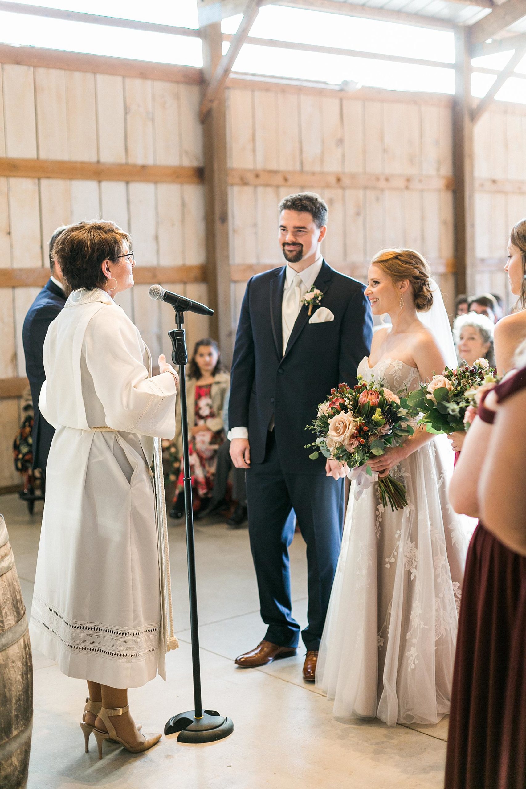 indoor barn wedding ceremony at lilac acres in milwaukee, wisconsin
