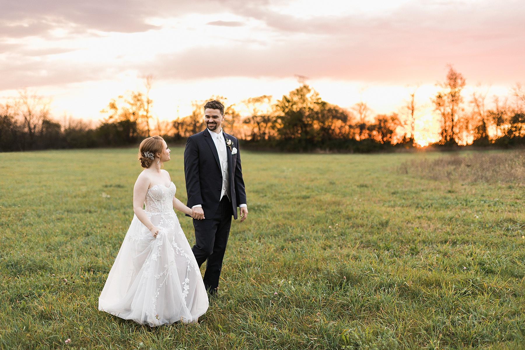 bride and groom couple sunset portrait in field for fall wedding at lilac acres in milwaukee wisconsin
