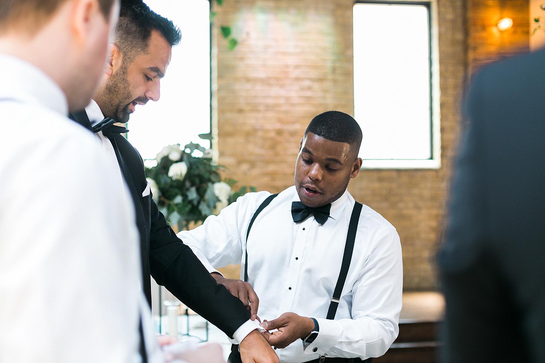 groom and groomsmen getting ready on wedding day at ivy house, milwaukee
