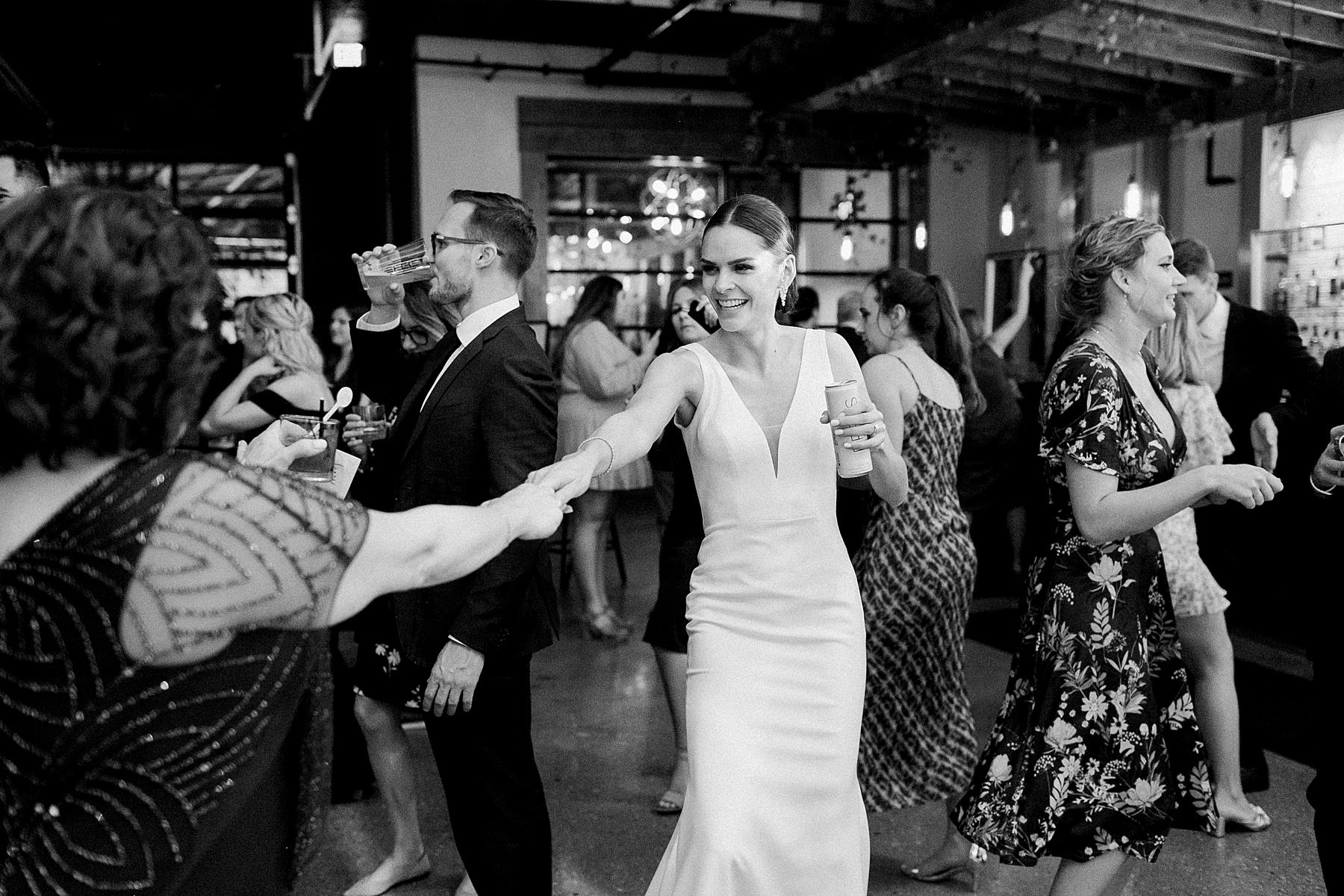 bride and guests dancing at wedding reception at ivy house, milwaukee, wisconsin