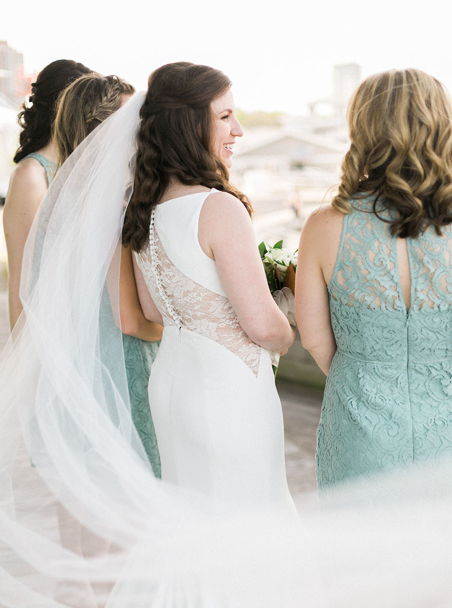 bridesmaid portrait, discovery world downtown milwaukee wisconsin, organic romantic elegant + modern city wedding day, greenery blue and neutrals, photo by laurelyn savannah photography