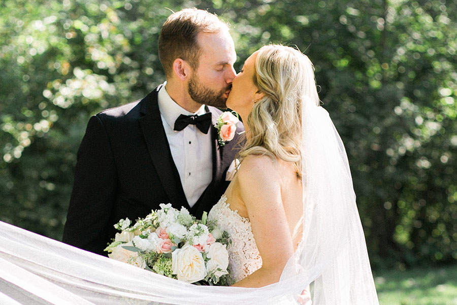 bride and groom at lake park and milwaukee athletic club elegant classic wedding, blush bridesmaids and belle fiori flowers, romantic summer wedding, photo by laurelyn savannah photography