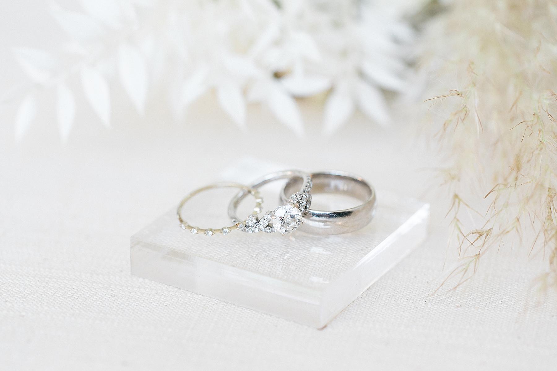 wedding ring bands next to white boho bouquet
