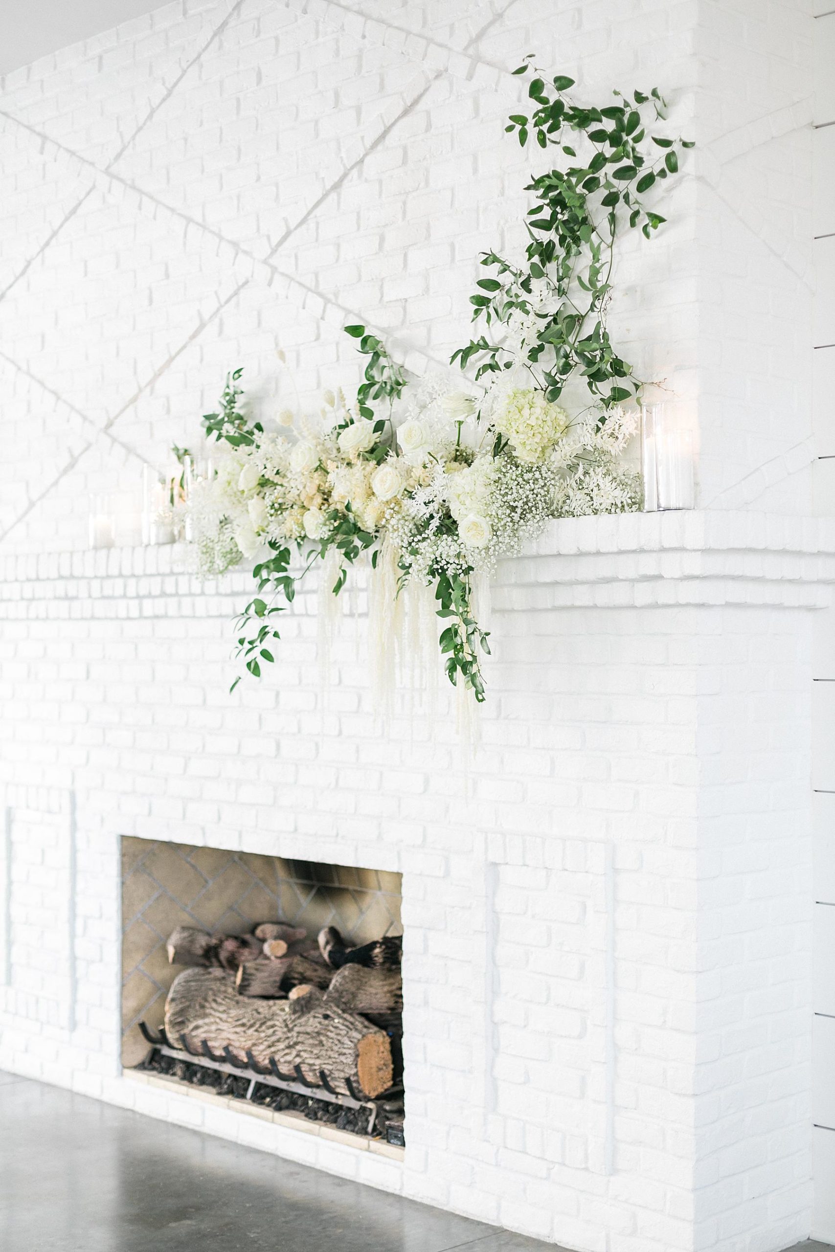 fireplace with boho flowers at hutton house white wedding venue in minneapolis minnesota