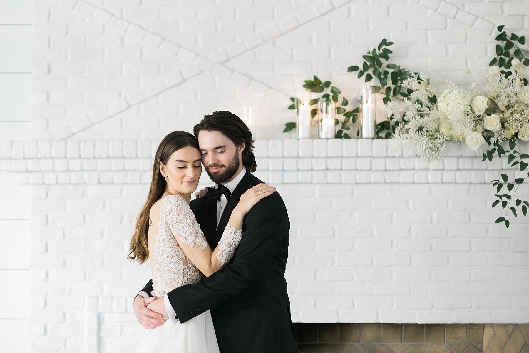 couple and boho flowers at hutton house white wedding venue in minneapolis minnesota