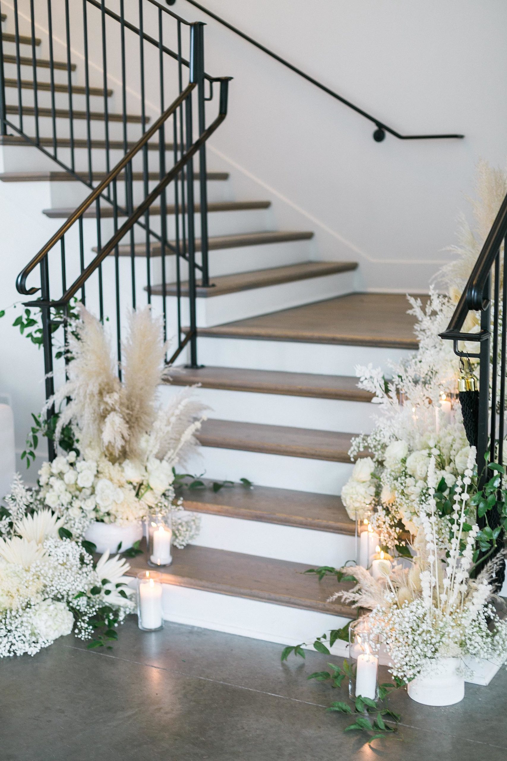 boho flowers on staircase at hutton house white wedding venue in minneapolis minnesota