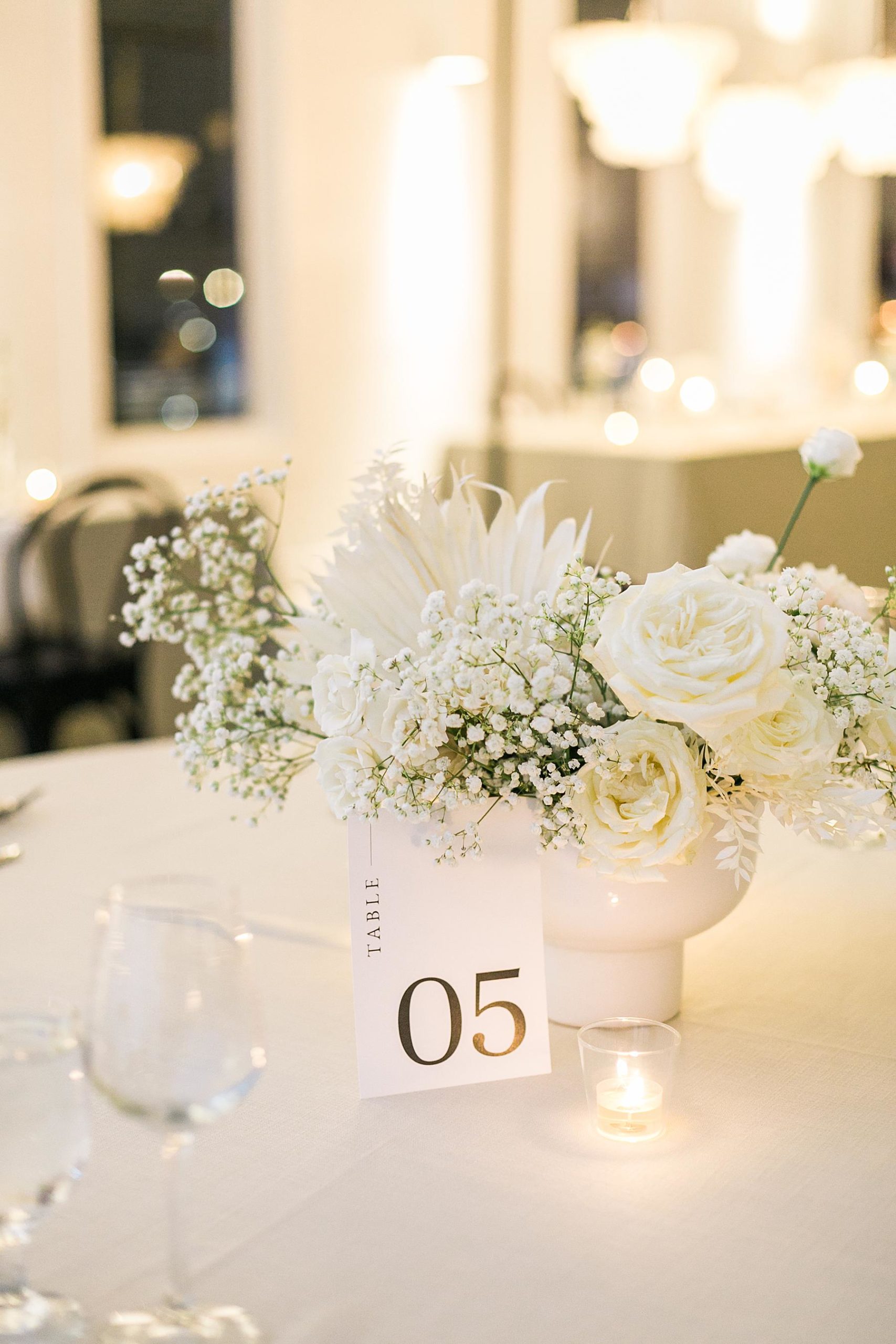 candlelight and black and white elegant boho reception table decor at hutton house wedding venue in minneapolis minnesota