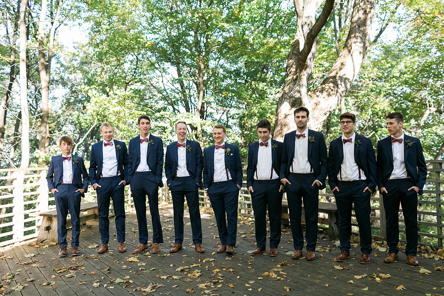 bridal party portraits fall autumn wedding with bridal party in mauve and navy blue