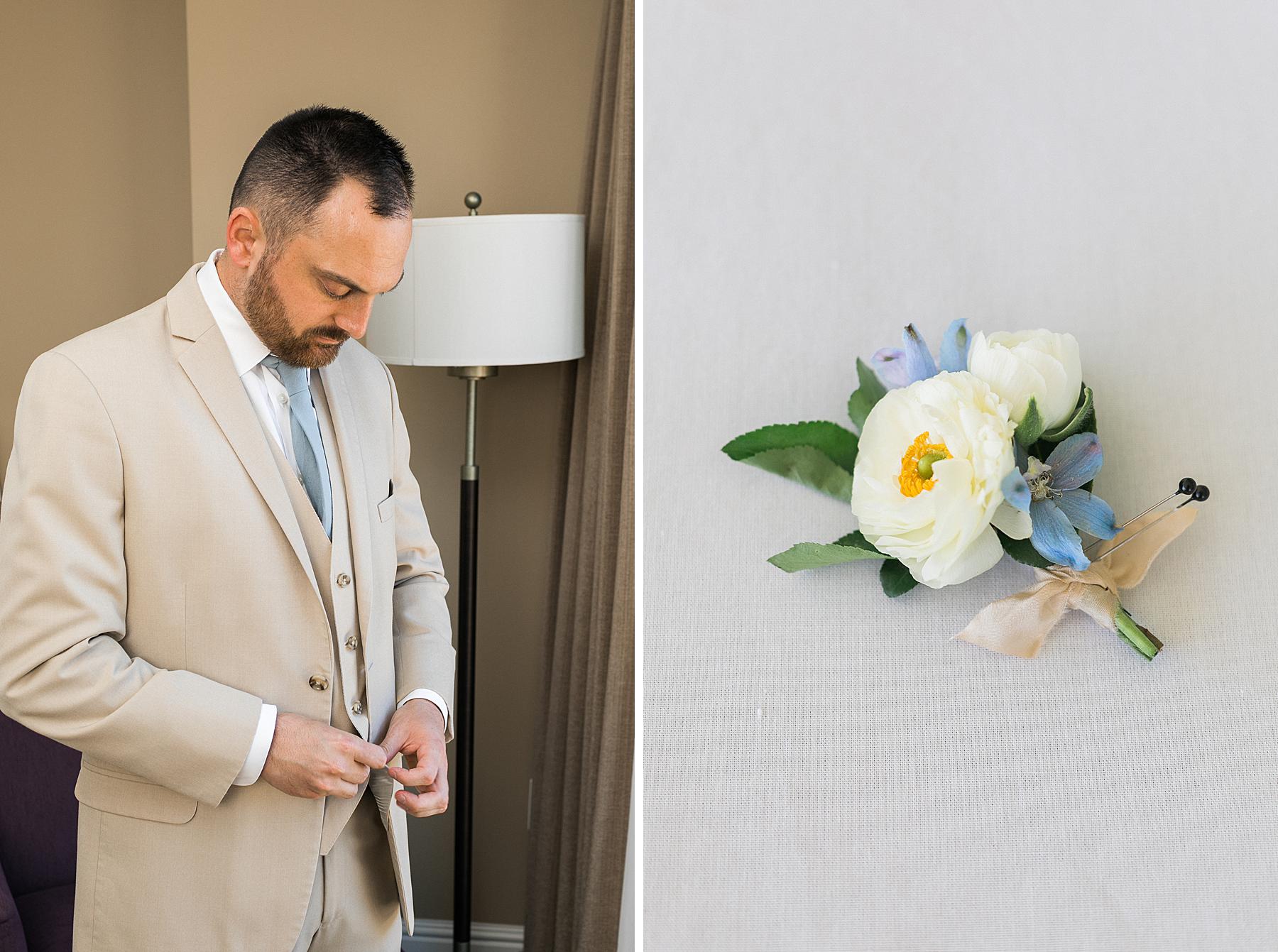 groom getting ready in tan suit buttoning suit buttons