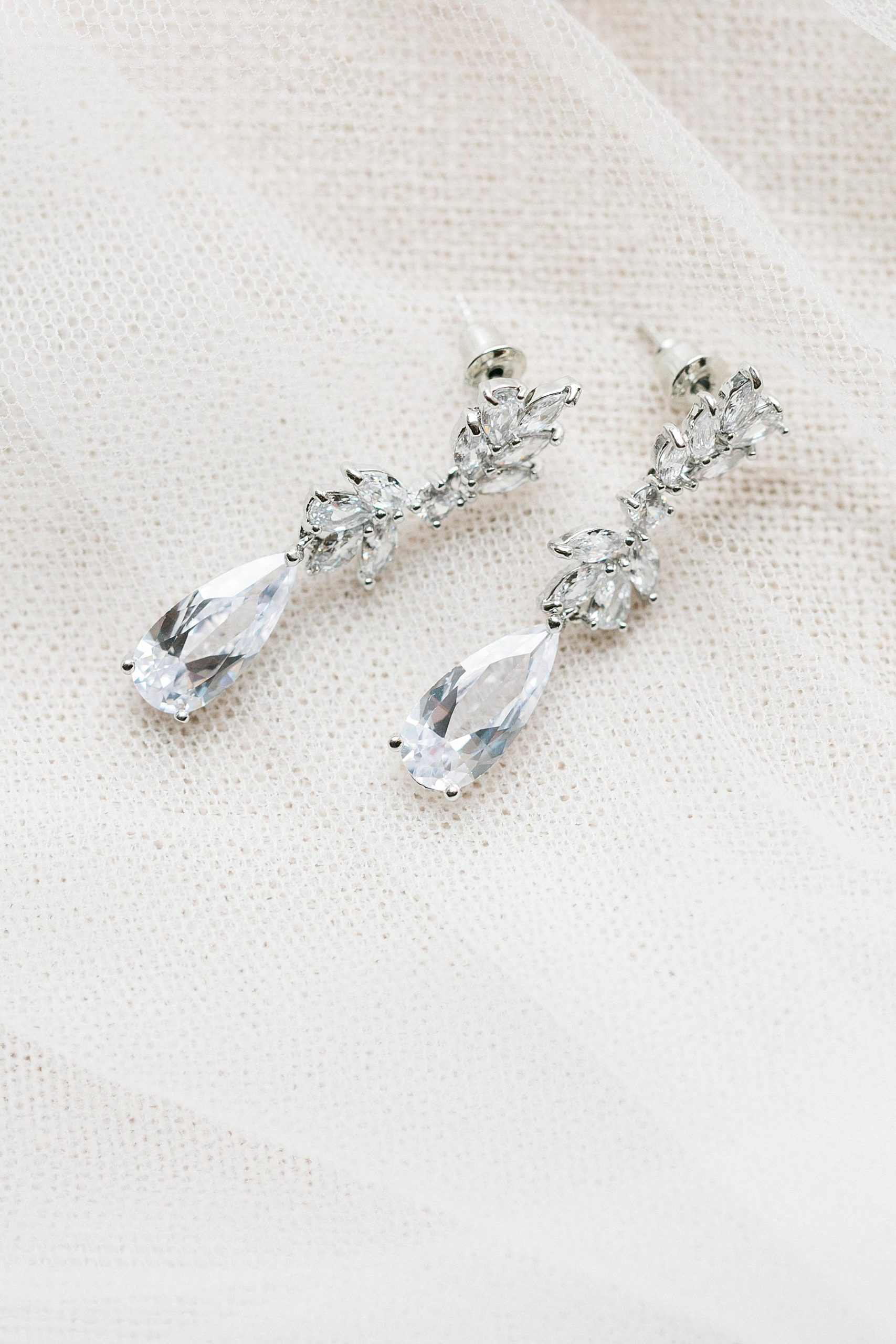 bridal earrings on wedding veil