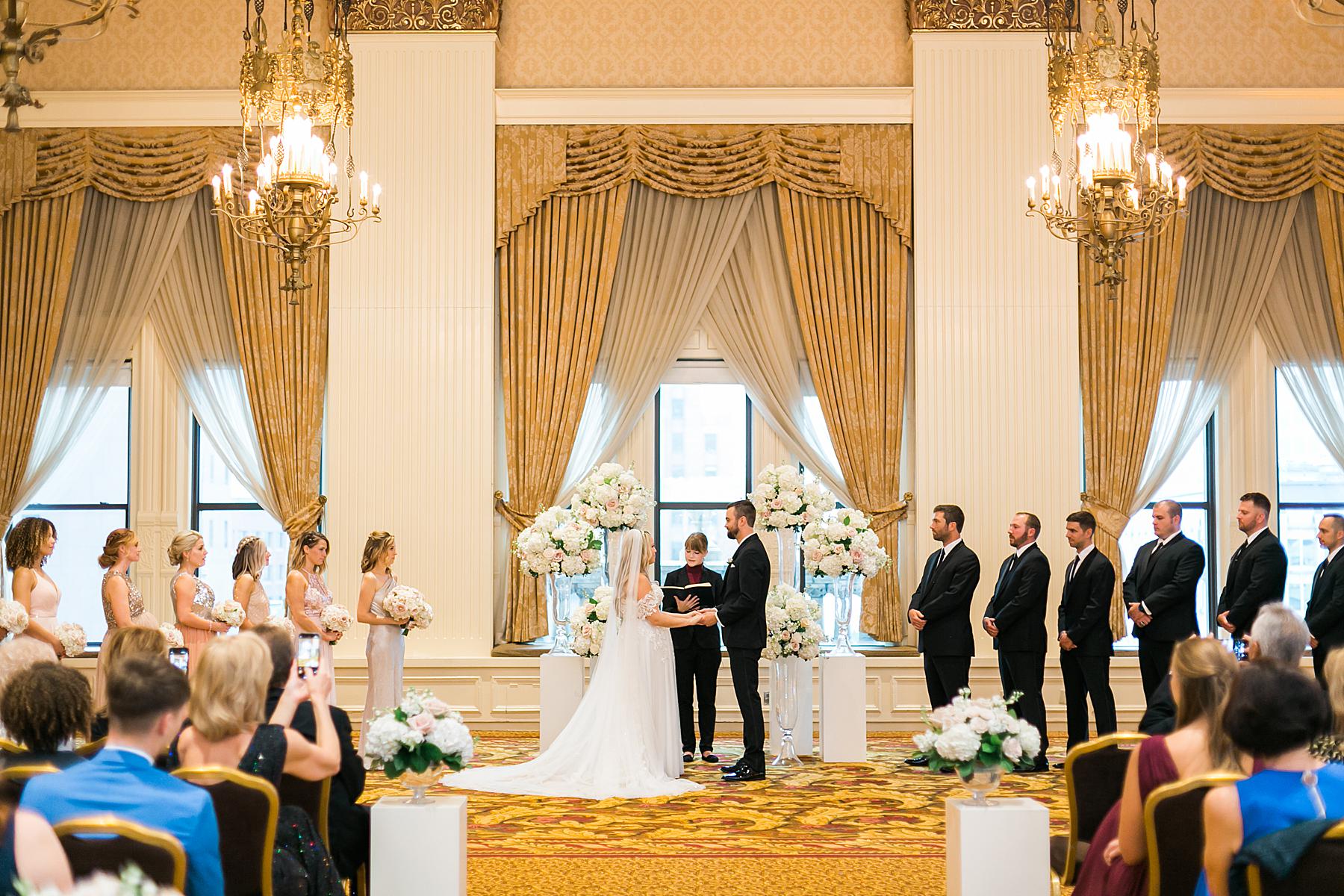 elegant gold ballroom wedding ceremony at the pfister hotel in milwaukee, wisconsin