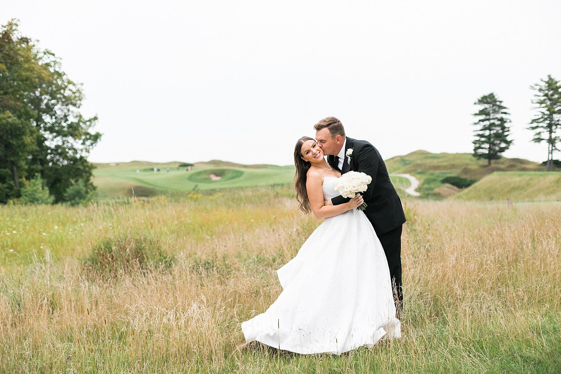 newlywed couples portrait bride and groom at irish barn at whistling straits in kohler wisconsin